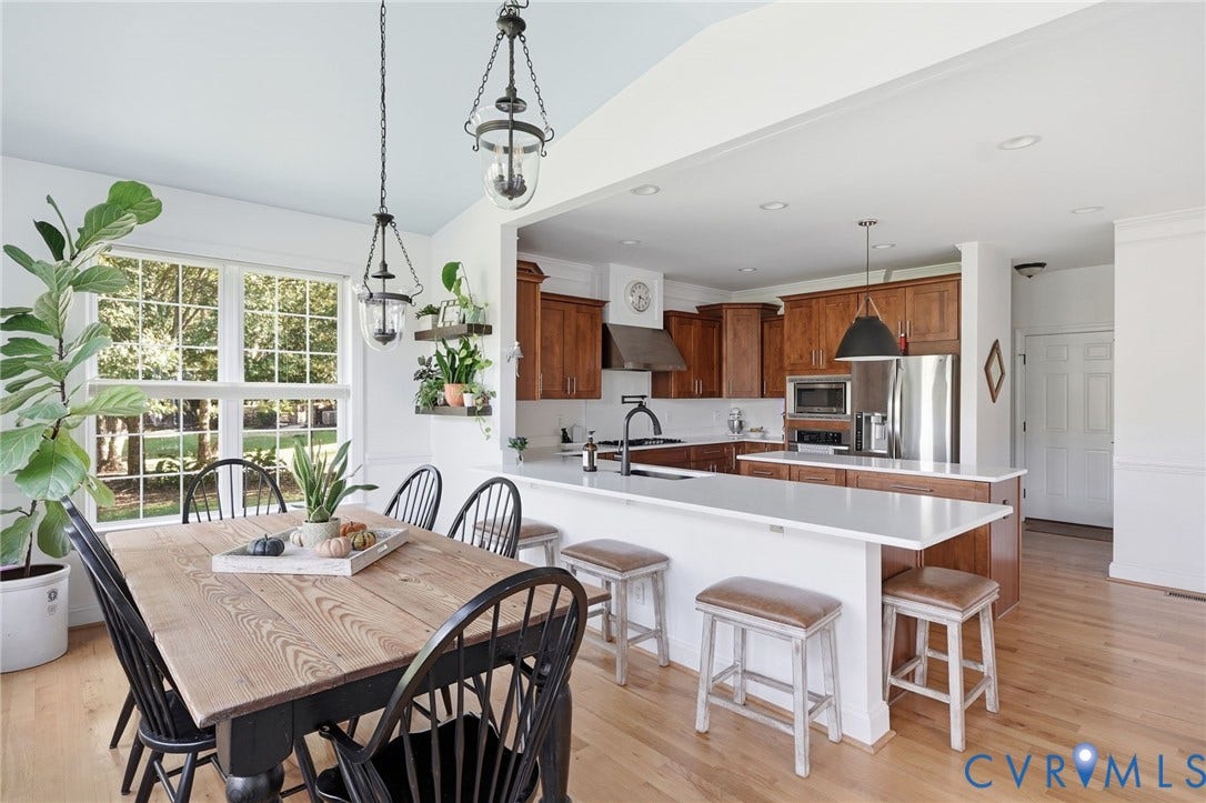 4502 Jennway Turn, Summer Lake, Moseley, VA 23120 Kitchen featuring wood cabinetry, a central island with a solid-surface countertop, stainless steel appliances, recessed lighting, and wood-finish flooring