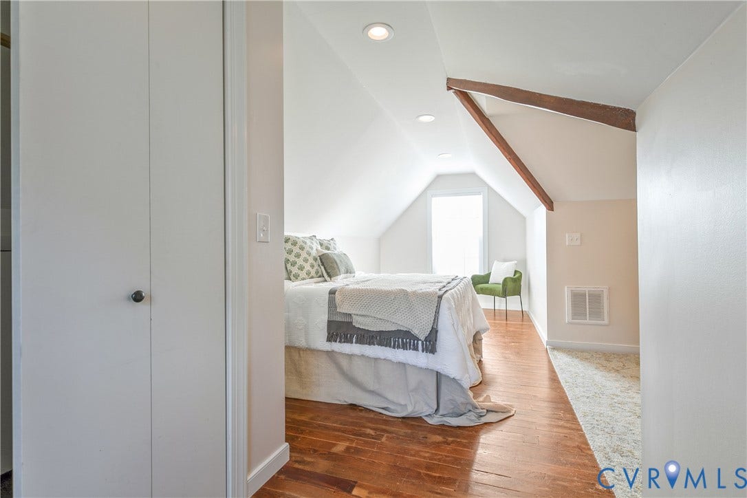 3006 Porter Street, Richmond, VA 23225 Sloped ceilings featuring exposed wooden beams, recessed lighting, wood-finish flooring, and a built-in closet with panel doors