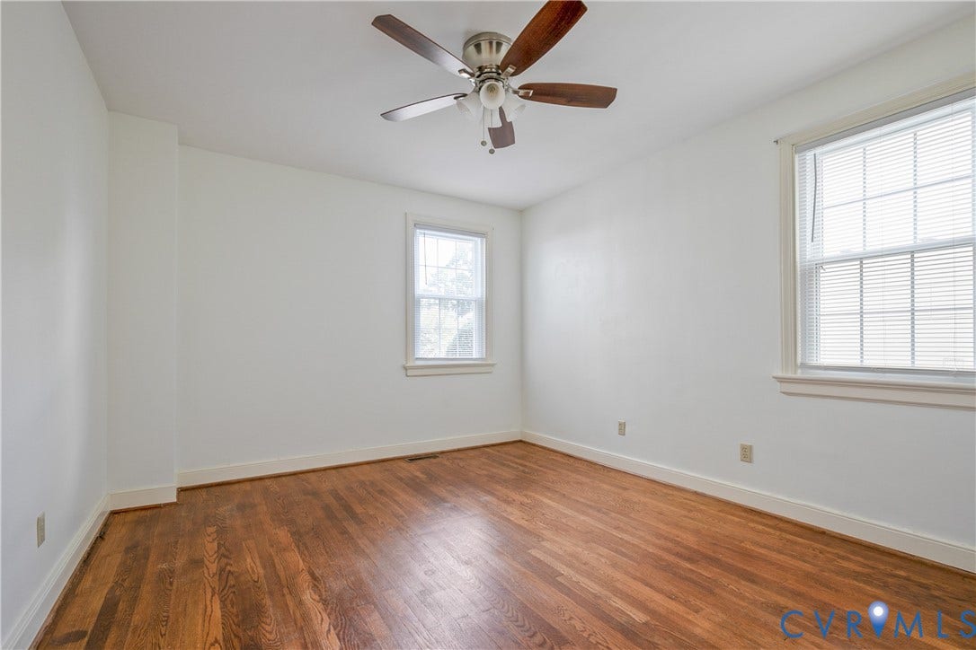 3006 Porter Street, Richmond, VA 23225 Room featuring wood-finish flooring, white walls, and a ceiling-mounted light fixture with a fan