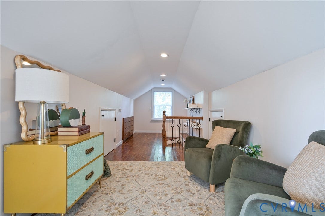 3006 Porter Street, Richmond, VA 23225 Vaulted ceiling featuring recessed lighting, wood-finish flooring, and an ornamental metal stair railing