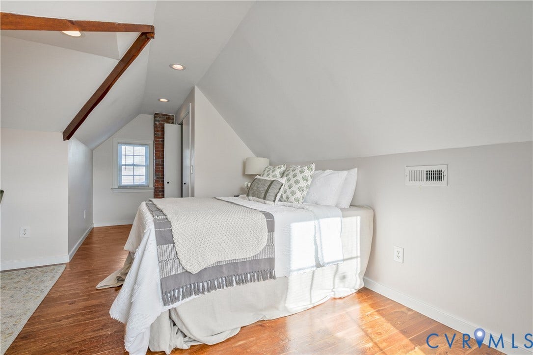 3006 Porter Street, Richmond, VA 23225 Vaulted ceilings featuring exposed wood beams, wood-finish flooring, recessed lighting, and an exposed brick accent detail
