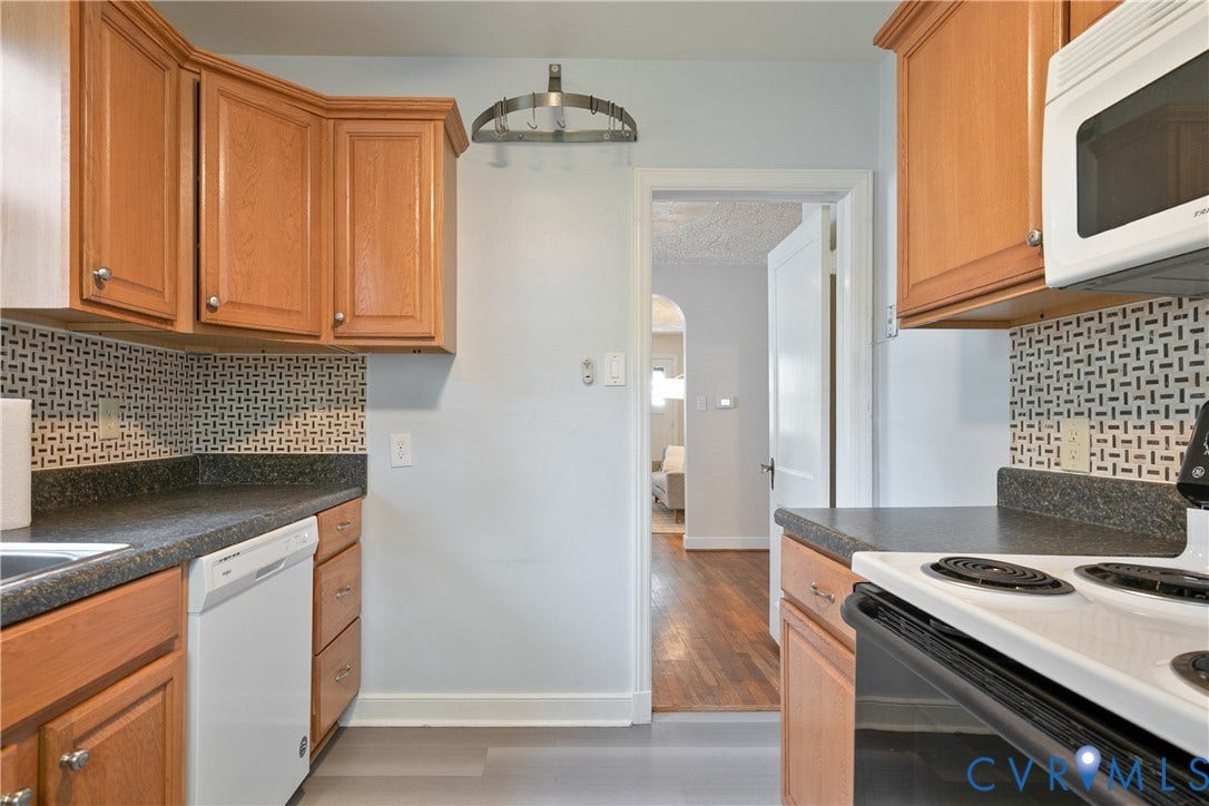 3006 Porter Street, Richmond, VA 23225 Kitchen featuring natural wood cabinetry, dark countertops, patterned tile backsplash, and built-in appliances