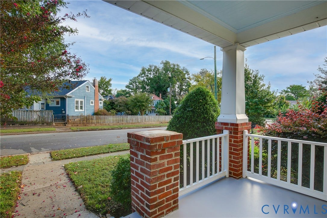 3006 Porter Street, Richmond, VA 23225 Covered front porch featuring a painted concrete floor, classic white railing, and brick pier bases