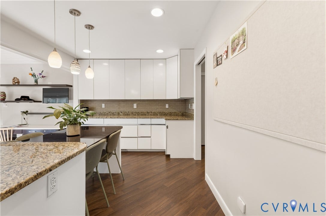 4204 Hickory Nut Place, Winterberry Ridge, Midlothian, VA 23112 Huge kitchen has additional cabinet space and countertop space just beyond the built-in granite top table for eating in the kitchen.