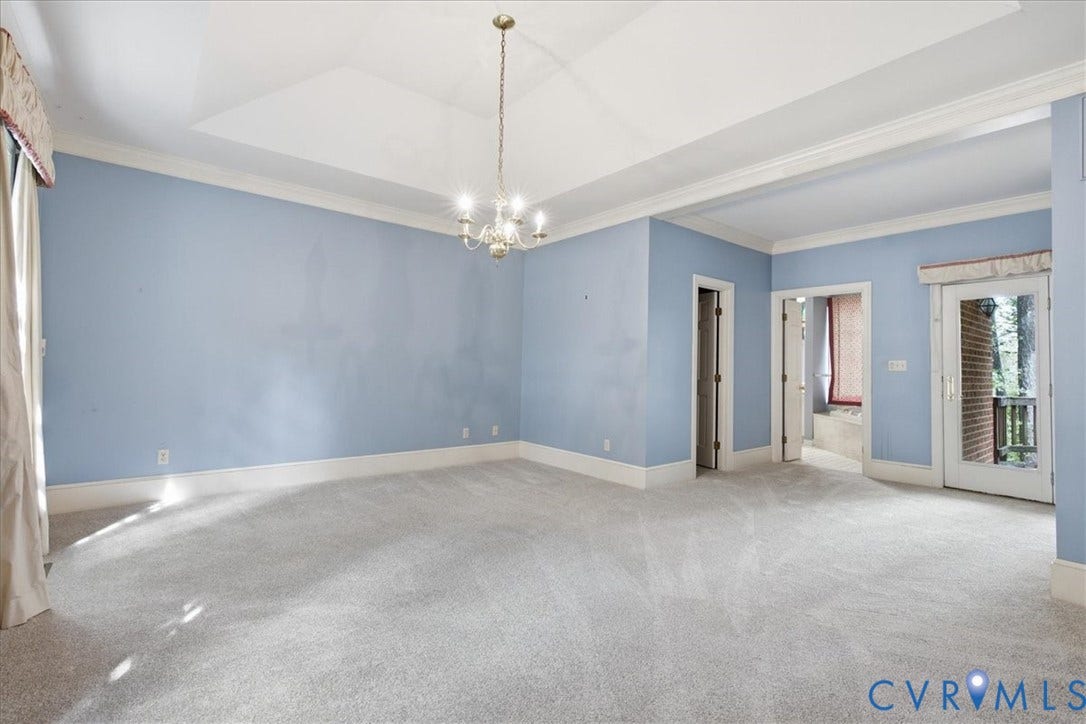 173 Waterfront Drive, Colonial Heights, VA 23834 The Primary Bedrooms Suite with Tray Ceiling, Walk-in Closet plus a Second Closet dresses/coats. Atrium style doors to the Deck and the entrance to the Primary Bath.
