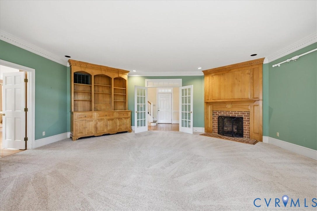 173 Waterfront Drive, Colonial Heights, VA 23834 View from the Great Room to the Entry through French Doors. Custom built fireplace and large custom built cabinet flank the French Doors.