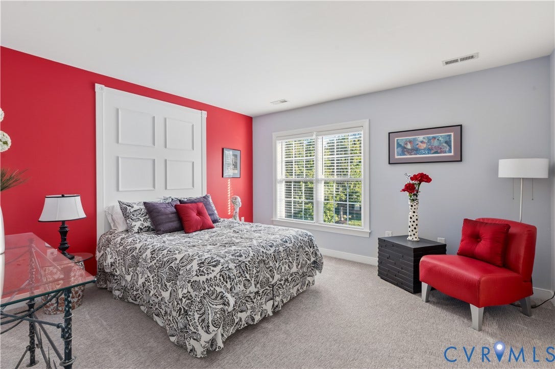 3360 Manor Grove Circle, Glen Allen, VA 23059 Room featuring wall-to-wall carpeting, a multi-pane window with white trim, and a decorative wall panel accent