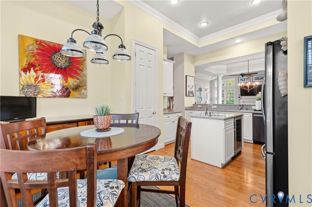3360 Manor Grove Circle, Glen Allen, VA 23059 Kitchen featuring wood-finish flooring, recessed lighting, white cabinetry, a center island with an integrated beverage refrigerator, and a multi-light pendant fixture