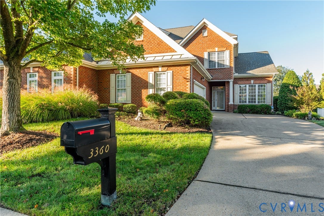 3360 Manor Grove Circle, Glen Allen, VA 23059 Multi-gabled brick exterior featuring decorative shutters, a concrete driveway, and professional landscaping