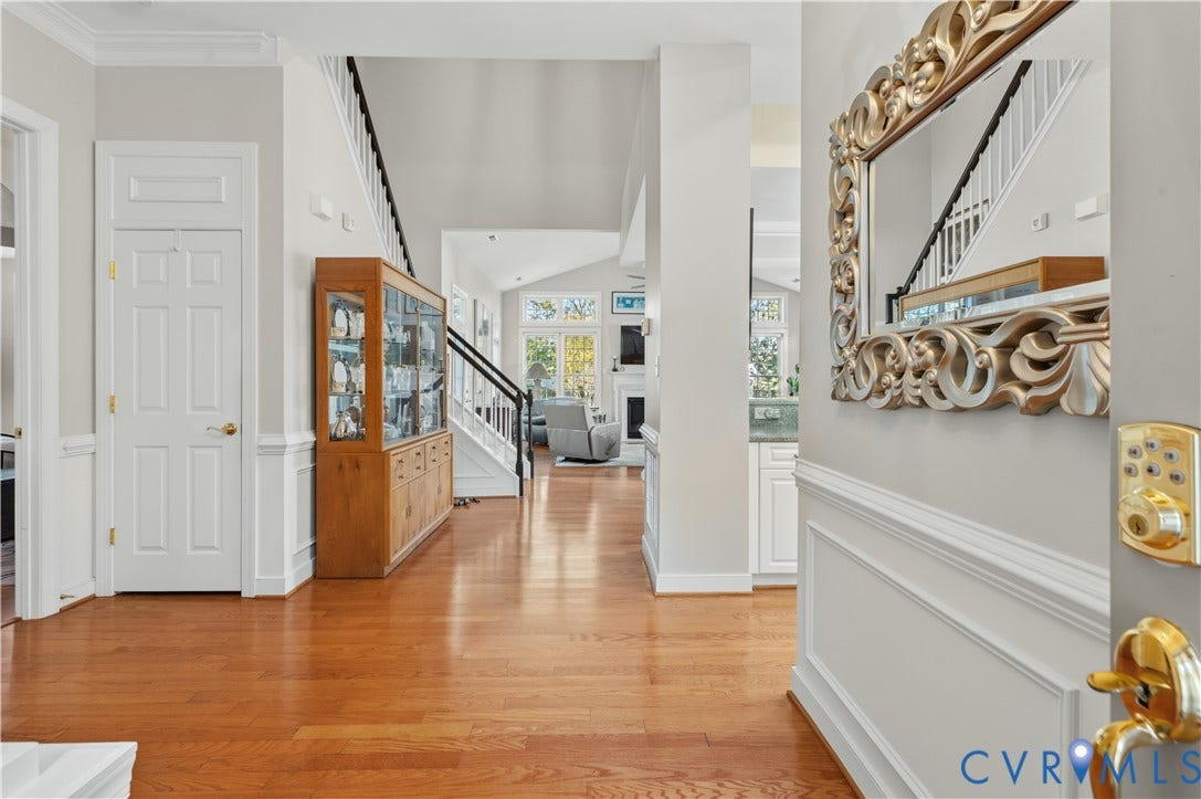3360 Manor Grove Circle, Glen Allen, VA 23059 Foyer featuring hardwood flooring, wainscoting, crown molding, and a staircase with a wooden handrail