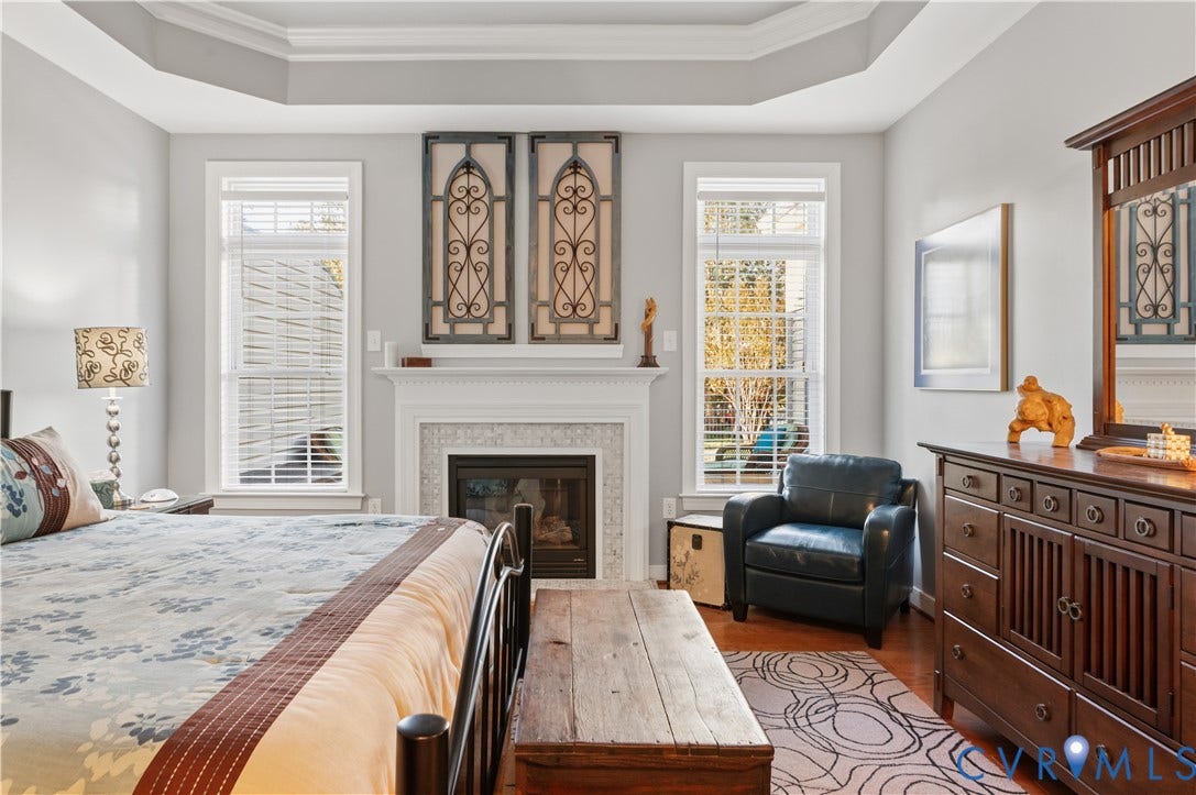 3360 Manor Grove Circle, Glen Allen, VA 23059 Tray ceiling, fireplace with detailed mantel and surround, wood-finish flooring, and dual windows
