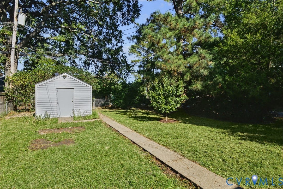 Spacious rear yard with Alley access.