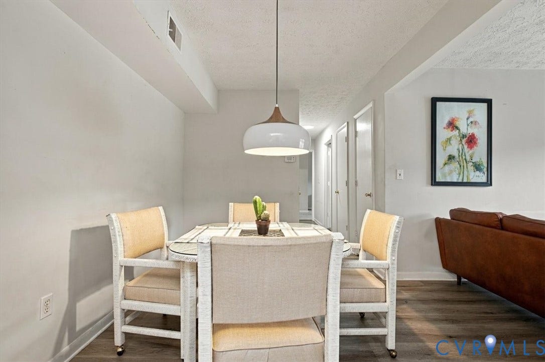 Wood-finish flooring and modern pendant lighting