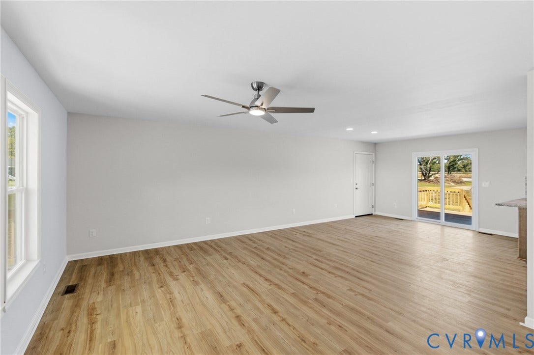 79 Dixie Drive, Mathews, VA 23050 Neutral interior featuring wood-finish flooring, recessed lighting, a modern ceiling fan, and sliding glass doors with exterior access