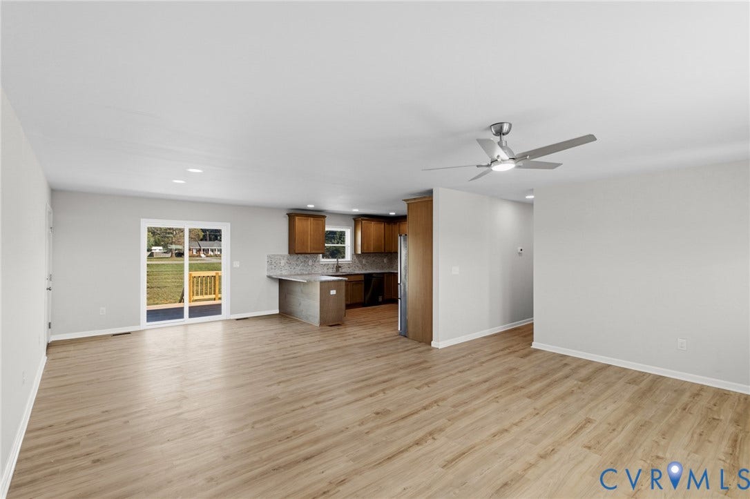 79 Dixie Drive, Mathews, VA 23050 Wood-finish flooring, recessed lighting, ceiling fan, wooden cabinetry, and glass sliding door