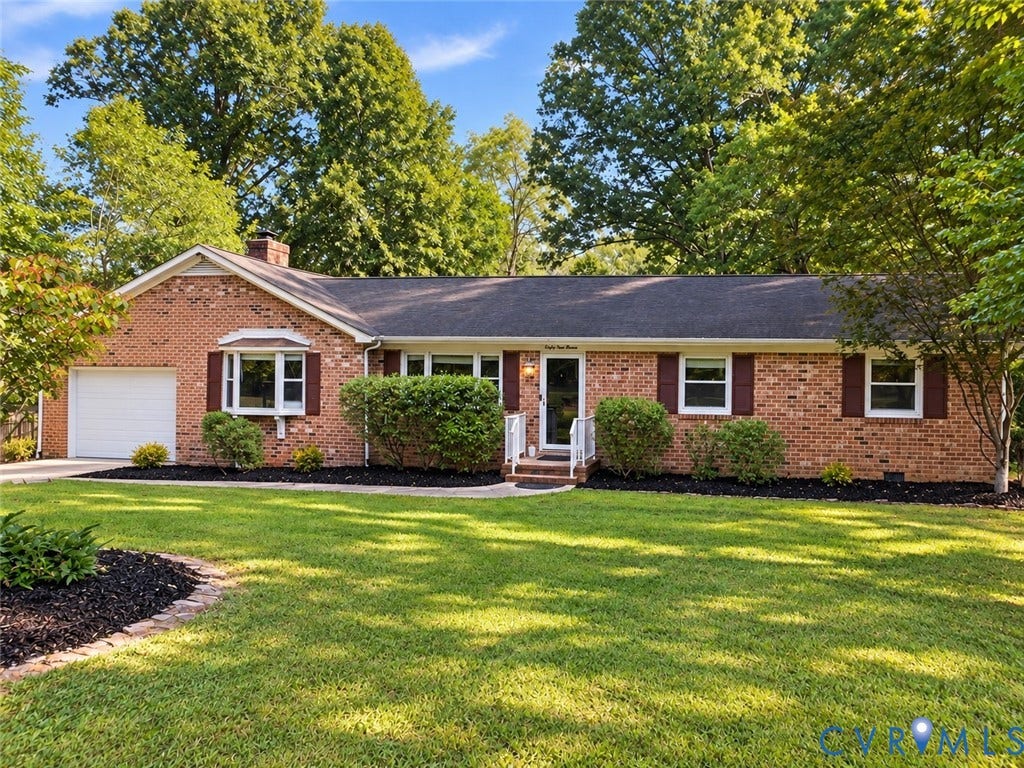 6411 Licking Creek Drive, Chesterfield, VA 23832 Ranch-style residence featuring a brick exterior, attached garage, bay window, dark-toned shutters, and mature landscaping