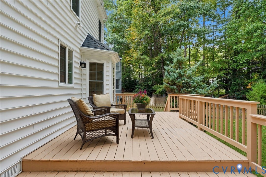 14800 Highberry Woods Drive, Midlothian, VA 23112 Raised exterior wood deck with vertical baluster railing and light-toned siding