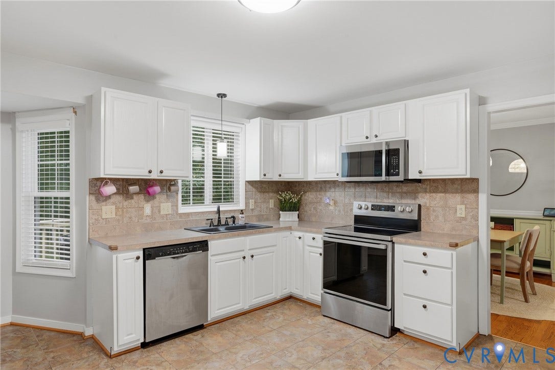 14800 Highberry Woods Drive, Midlothian, VA 23112 Kitchen featuring white cabinetry, stainless steel appliances, tiled backsplash, neutral-toned countertops, and tile flooring