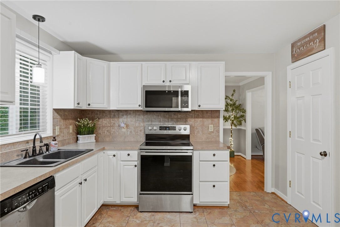 14800 Highberry Woods Drive, Midlothian, VA 23112 Kitchen featuring white shaker-style cabinetry, stainless steel appliances, ceramic tile backsplash, dual-basin sink with a gooseneck faucet, and tile flooring