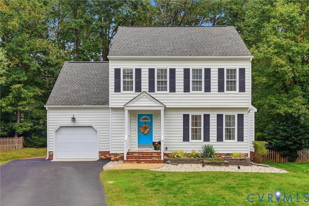 14800 Highberry Woods Drive, Midlothian, VA 23112 Two-story exterior featuring white horizontal siding, dark shutters, a brick-accented front entry, an attached garage, and stone-bordered landscaping