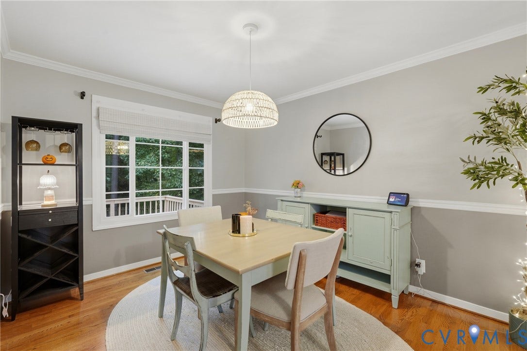14800 Highberry Woods Drive, Midlothian, VA 23112 Room featuring wood-finish flooring, crown molding, chair rail trim, and a woven pendant light fixture