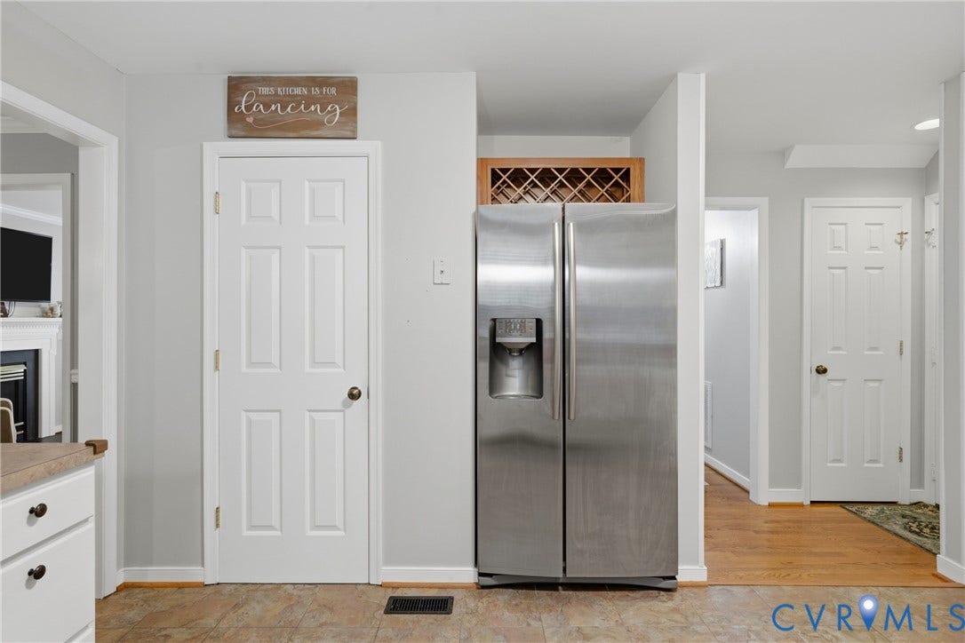 14800 Highberry Woods Drive, Midlothian, VA 23112 Stainless steel side-by-side refrigerator, built-in wooden wine rack, and solid-core paneled interior doors