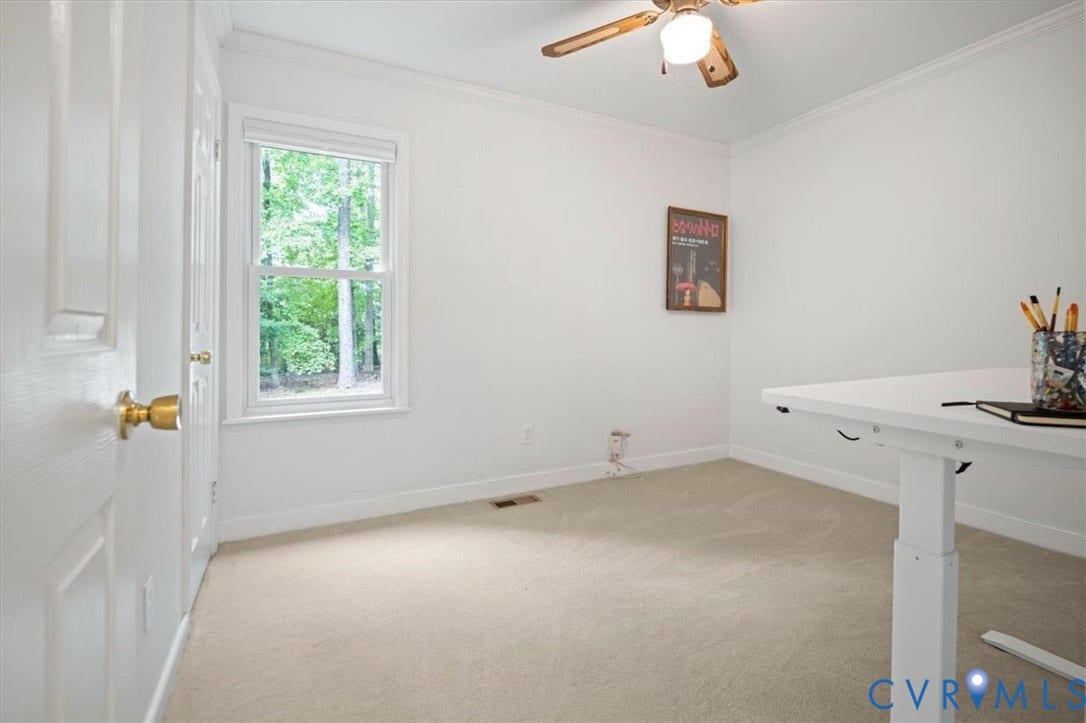 10209 Francill Court, North Chesterfield, VA 23236 Neutral-toned carpeting, crown molding, double-hung window, and ceiling-mounted light fixture with fan blades