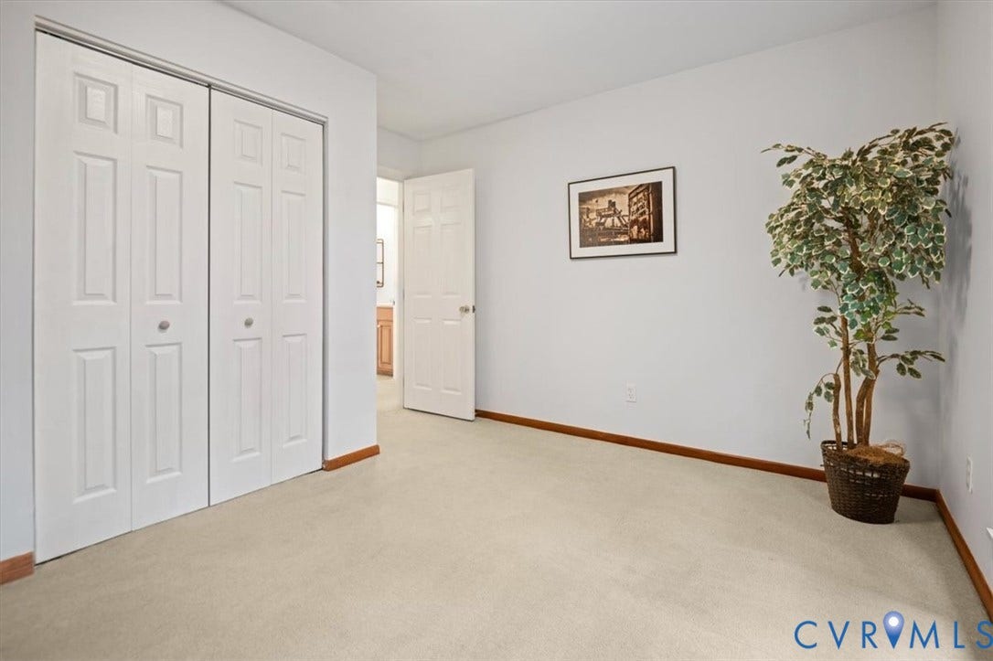 10209 Francill Court, North Chesterfield, VA 23236 Neutral-toned wall-to-wall carpeting, dual-panel bifold closet doors, and solid-core interior doors with metal hardware