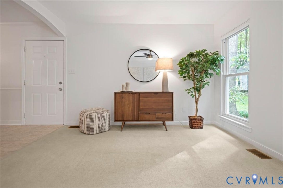 10209 Francill Court, North Chesterfield, VA 23236 Neutral wall-to-wall carpeting, white interior walls, and a large double-hung window providing natural light