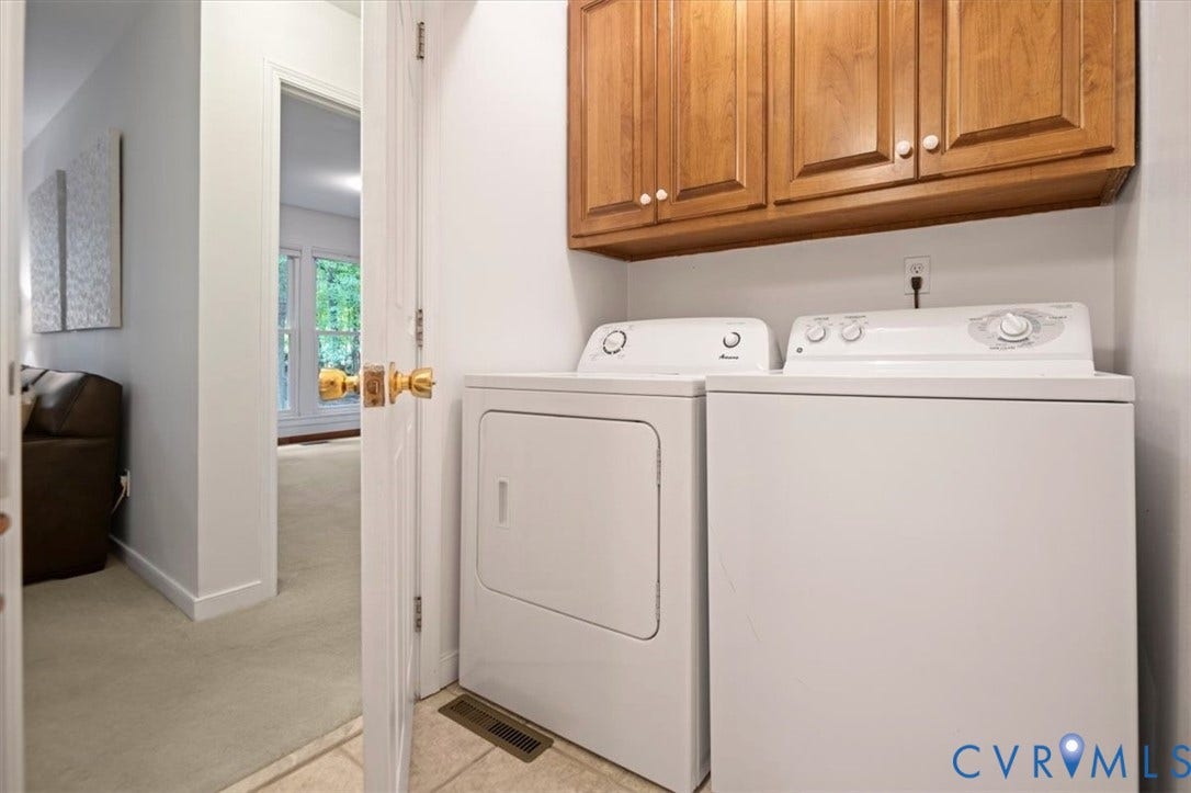 10209 Francill Court, North Chesterfield, VA 23236 Laundry area featuring wall-mounted wooden cabinetry and tiled flooring