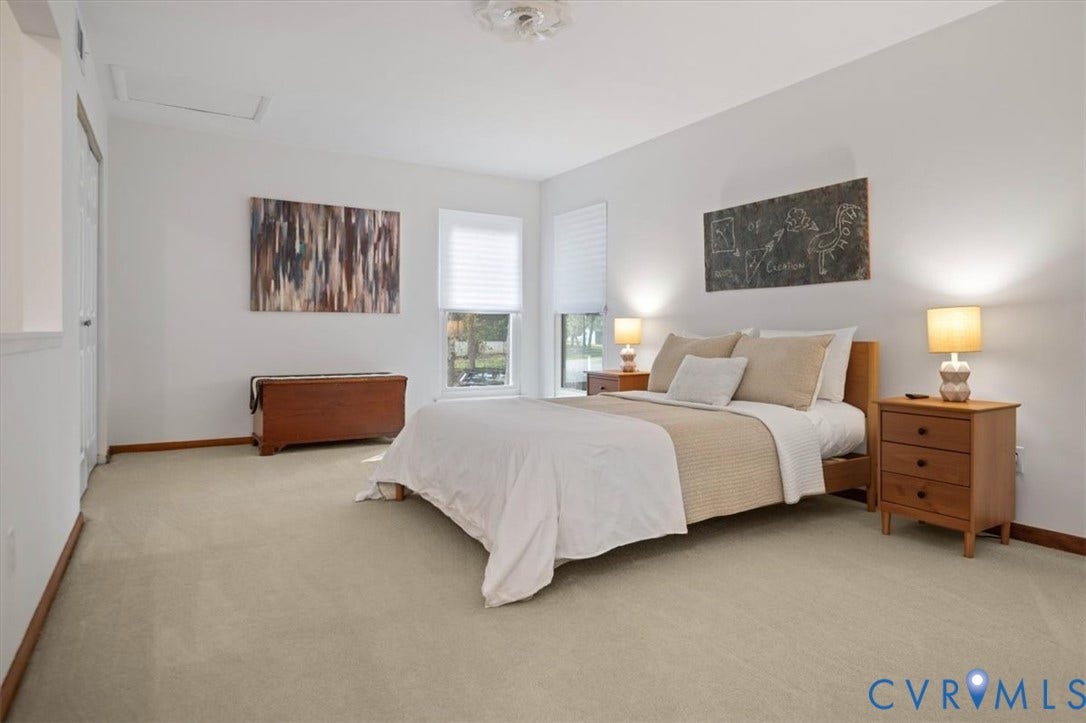 10209 Francill Court, North Chesterfield, VA 23236 Neutral-toned carpeting, dual windows with fitted shades, and a ceiling-mounted light fixture