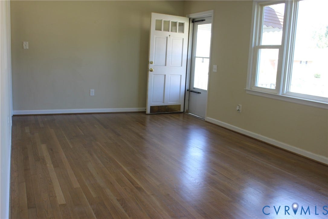 905 Williamsburg Road, Colonial Heights, VA 23834 Interior space featuring wood-finish flooring, a multi-pane glass entry door with a brass kick plate, and large double-hung windows