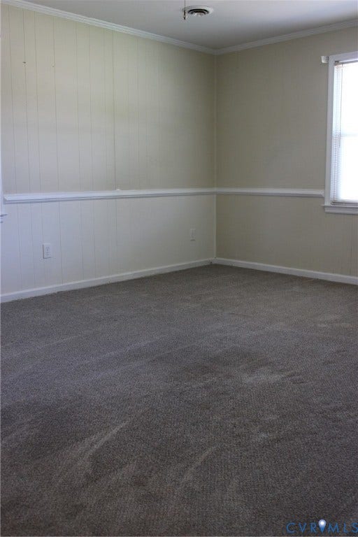 905 Williamsburg Road, Colonial Heights, VA 23834 Room featuring vertical panel wall treatments, chair rail molding, wall-to-wall carpeting, and a window with integrated blinds