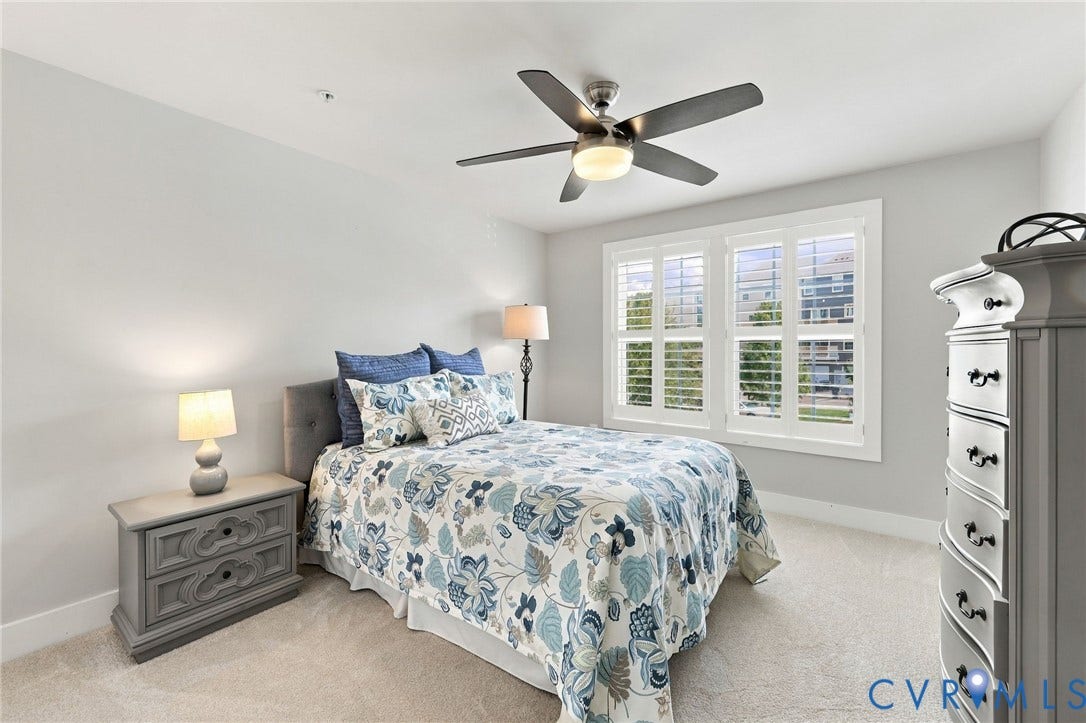 4223 Saunders Tavern Trail, #A, Henrico, VA 23233 Room featuring neutral-toned carpeting, high-contrast ceiling fan with integrated lighting, and multi-pane windows equipped with plantation shutters