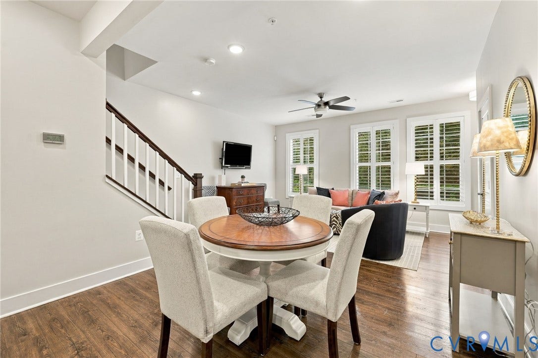4223 Saunders Tavern Trail, #A, Henrico, VA 23233 Wood-finish flooring, staircase with a dark wood handrail and white balusters, recessed lighting, ceiling fan, and multi-pane windows with plantation shutters