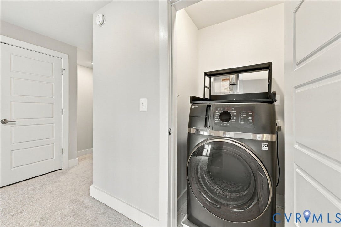 4223 Saunders Tavern Trail, #A, Henrico, VA 23233 Laundry closet featuring neutral wall paint, carpeted flooring, and a multi-panel interior door