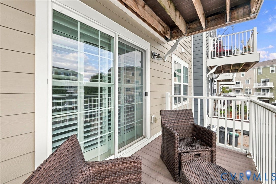 4223 Saunders Tavern Trail, #A, Henrico, VA 23233 Private balcony featuring horizontal composite decking, white metal railing, and sliding glass doors with grid detailing