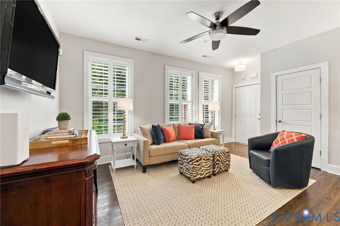 4223 Saunders Tavern Trail, #A, Henrico, VA 23233 Dark-toned wood-finish flooring, plantation shutters, and a multi-blade ceiling fan with integrated lighting