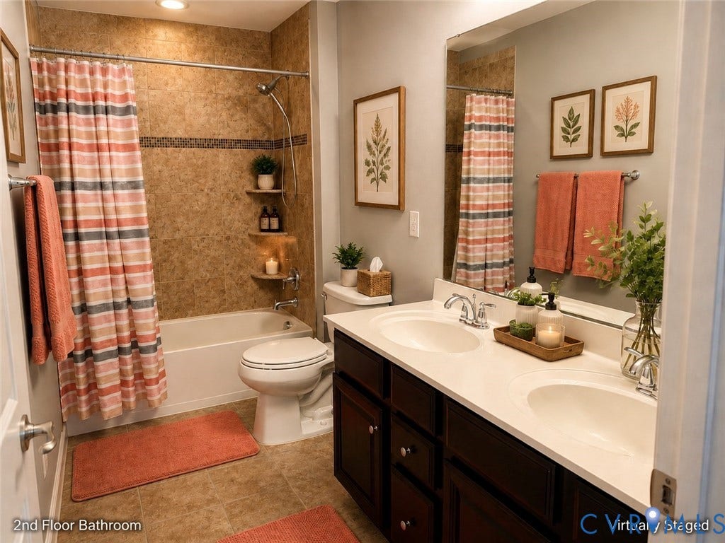 Second-floor bathroom featuring a dual-sink vanity with white countertops, dark wood cabinetry, and chrome fixtures, along with tiled flooring and a tub/shower combination with tiled surround