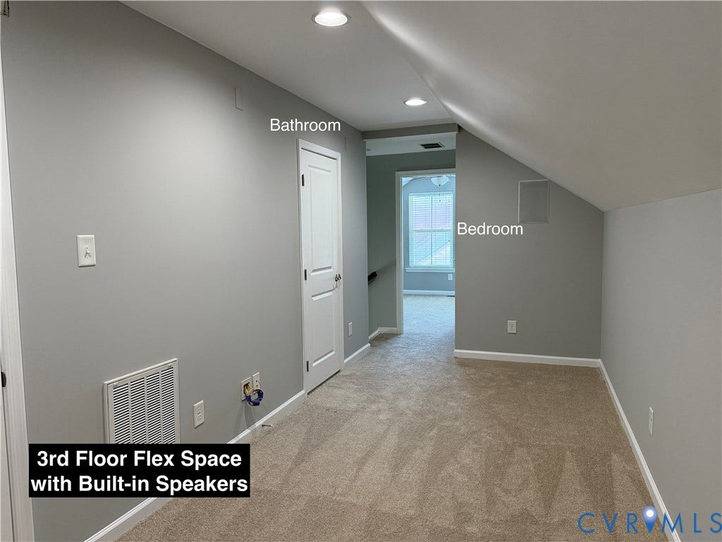 Upper-level space featuring neutral carpeting, recessed lighting, and integrated wall-mounted speakers