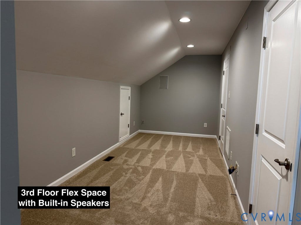 Finished space featuring a sloped ceiling, wall-to-wall carpeting, recessed lighting, integrated ceiling speakers, and access to crawl space storage