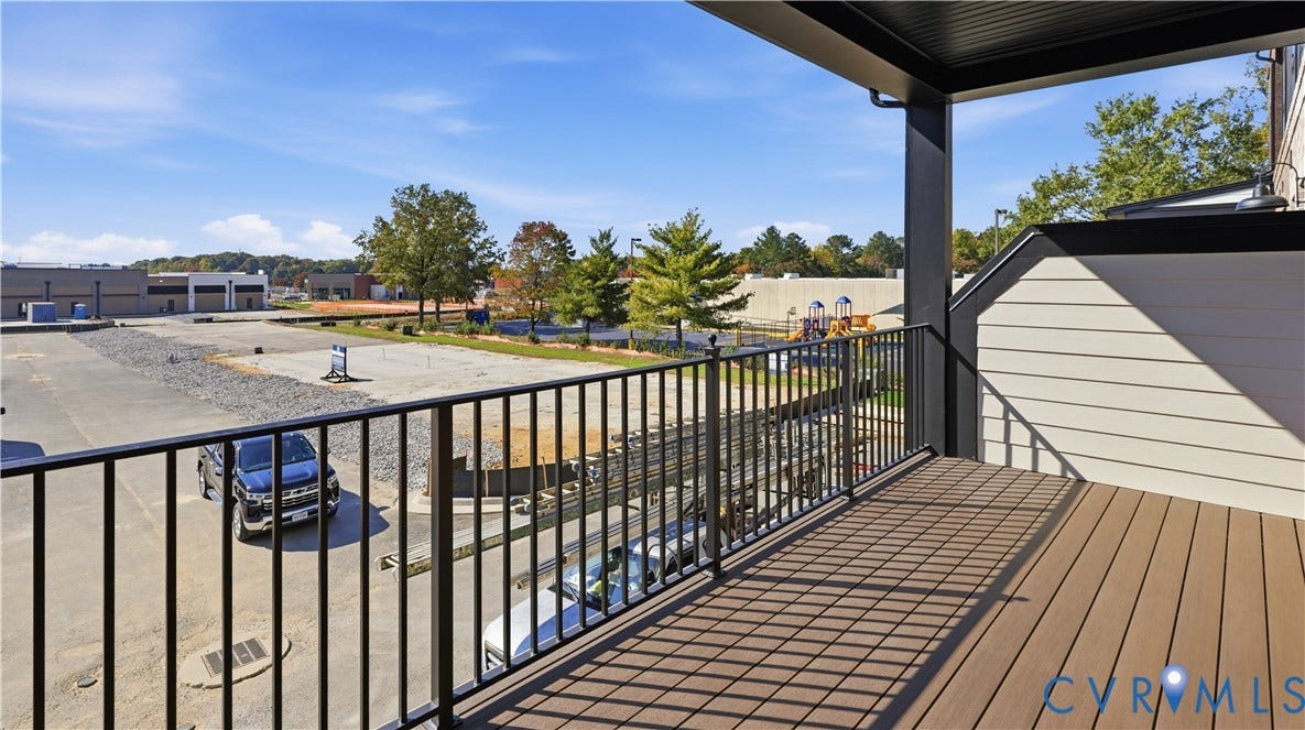 11612 Switch Drive, Midlothian Depot, Midlothian, VA 23113 Covered exterior balcony featuring synthetic wood-finish decking and black metal railing