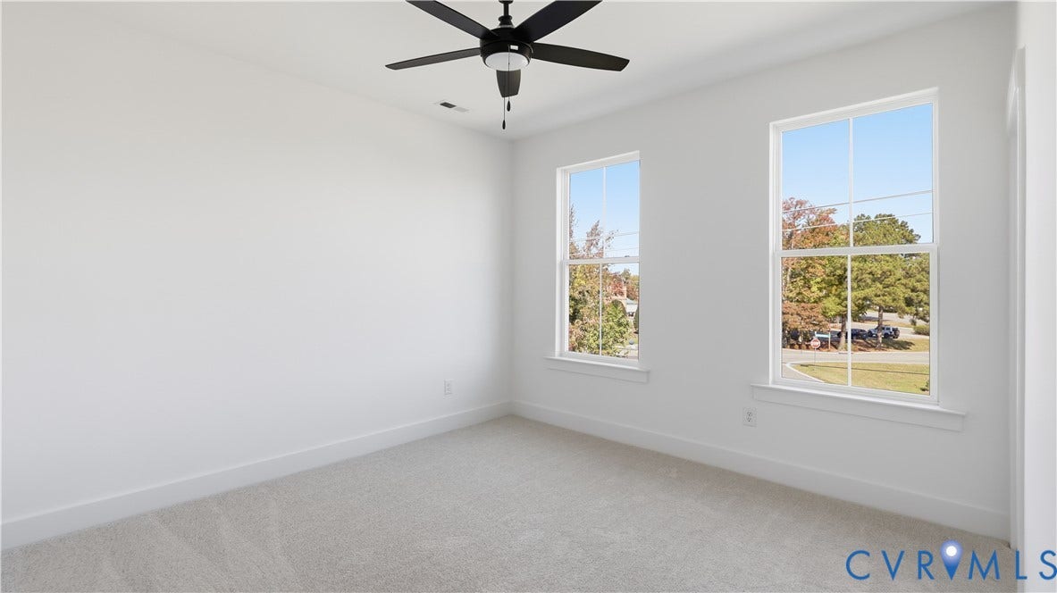 11612 Switch Drive, Midlothian Depot, Midlothian, VA 23113 Neutral-toned carpeting, dual double-hung windows, and a matte black ceiling fan