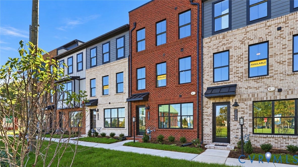 11612 Switch Drive, Midlothian Depot, Midlothian, VA 23113 Multi-story brick and masonry exterior featuring large windows with black frames, metal door awnings, and architectural panel accents