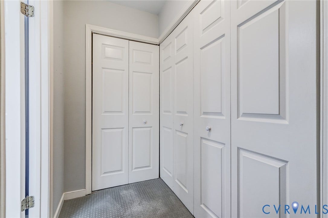 1109 Lakeland Circle, Henrico, VA 23229 Built-in closets with white multi-panel bi-fold doors and circular hardware