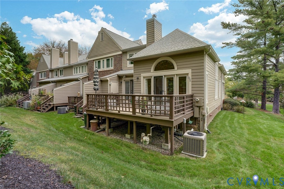 1109 Lakeland Circle, Henrico, VA 23229 Multi-level exterior featuring horizontal lap siding, a brick facade, and an elevated wood deck with perimeter railing