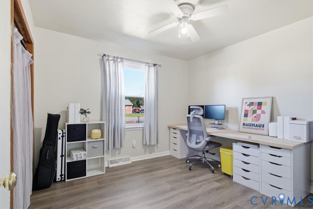 2609 Maury Road, Prince George, VA 23805 Neutral-toned room with wood-finish flooring, single-hung window, and ceiling fan with integrated light fixture
