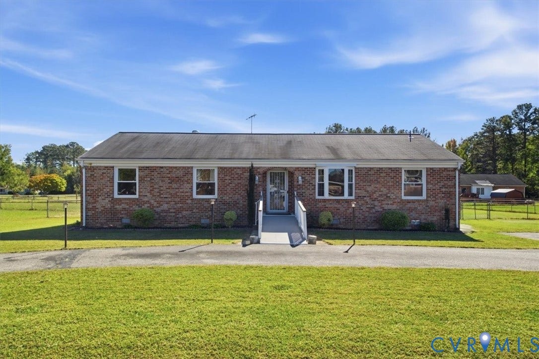 2609 Maury Road, Prince George, VA 23805 Single-story brick exterior featuring a multi-pane bay window, shingle roofing, and an asphalt driveway