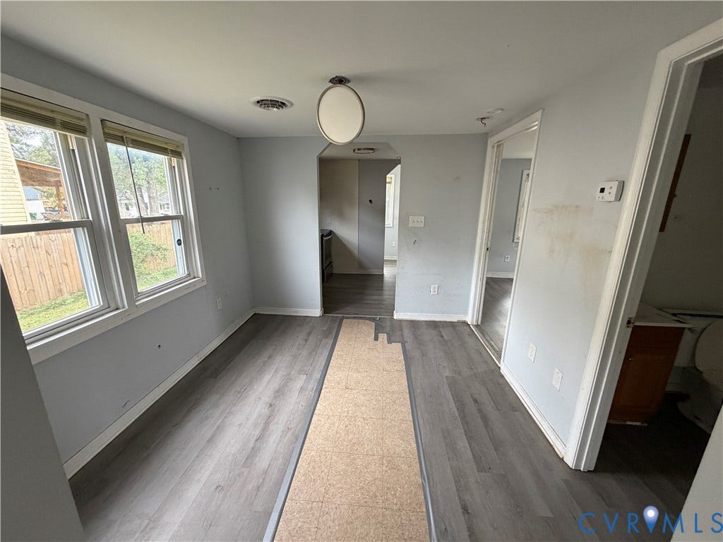 334 S 17th Avenue, Hopewell, VA 23860 Interior room featuring wood-finish flooring, dual pane windows, and a flush-mount overhead light fixture