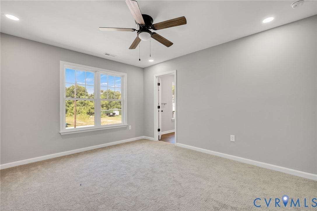 914 Diamond Street, Petersburg, VA 23803 Interior space featuring neutral wall tones, plush wall-to-wall carpeting, recessed ceiling lighting, and a multi-blade ceiling fan with integrated light fixture